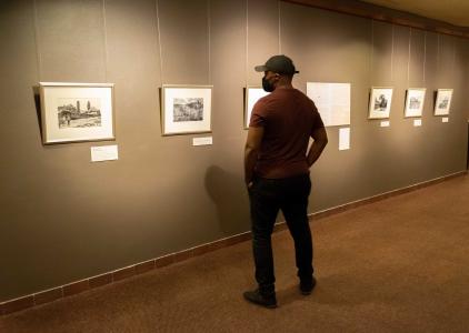 Patron looking at the Great Flood of 1921 exhibit.