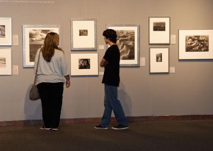 Patrons looking at the Vital Waters exhibit.